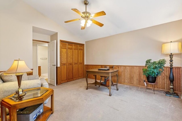 2942 White Oaks Ln, Buchanan, MI 49107 - home office with ceiling fan, vaulted ceiling, a wainscoted wall, light carpet, and wooden walls