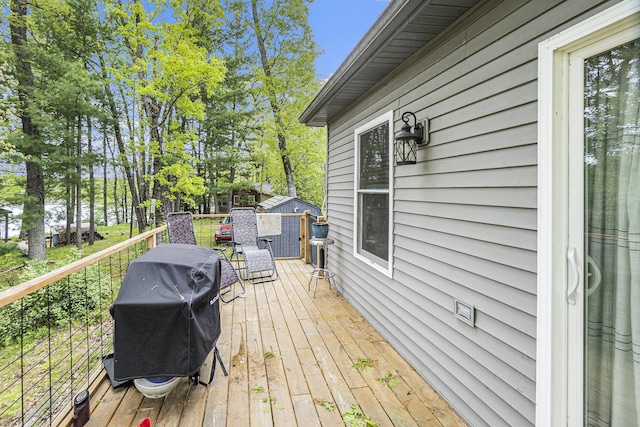3921 Wildwood Ave, Bitely, MI 49309 - deck featuring grilling area and view of scattered trees