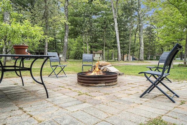 3921 Wildwood Ave, Bitely, MI 49309 - view of patio / terrace with a fire pit