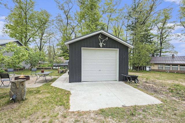 3921 Wildwood Ave, Bitely, MI 49309 - detached garage featuring concrete driveway