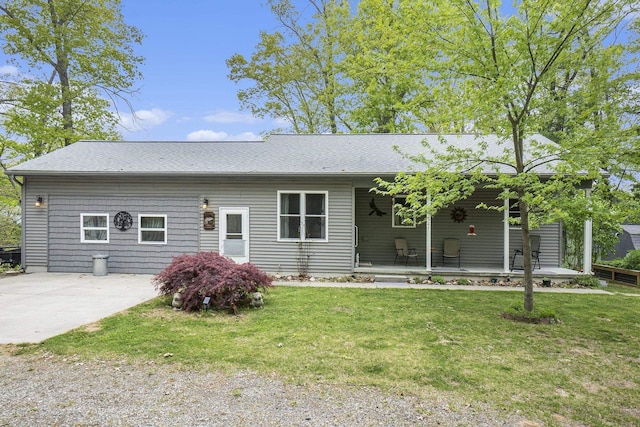 3921 Wildwood Ave, Bitely, MI 49309 - single story home featuring a porch, a front yard, and a shingled roof