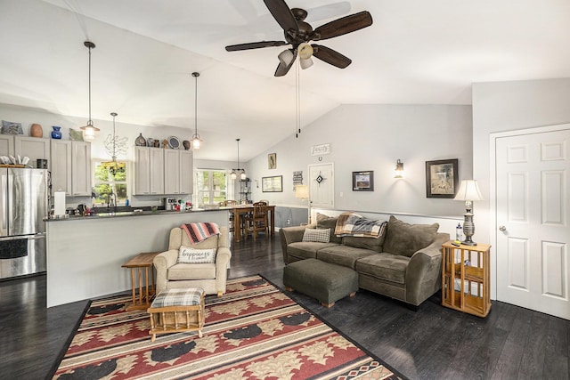 3921 Wildwood Ave, Bitely, MI 49309 - living area featuring ceiling fan, vaulted ceiling, and dark wood-type flooring
