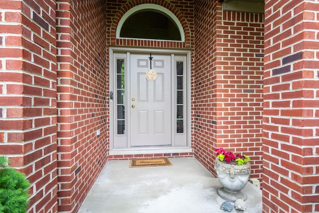 7009 Suncrest Dr, Saline, MI 48176 - property entrance featuring brick siding