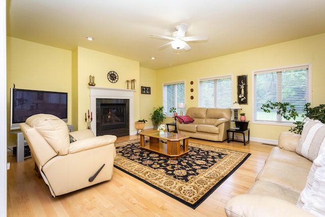 7009 Suncrest Dr, Saline, MI 48176 - living room featuring ceiling fan, light wood-style flooring, a fireplace, baseboards, and recessed lighting