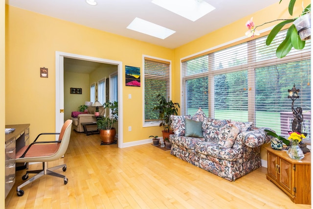 7009 Suncrest Dr, Saline, MI 48176 - office featuring a skylight, light wood-type flooring, and baseboards