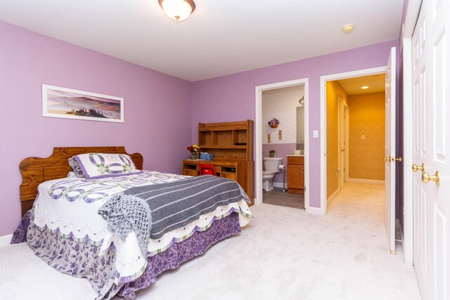 7009 Suncrest Dr, Saline, MI 48176 - bedroom with carpet, ensuite bath, and baseboards
