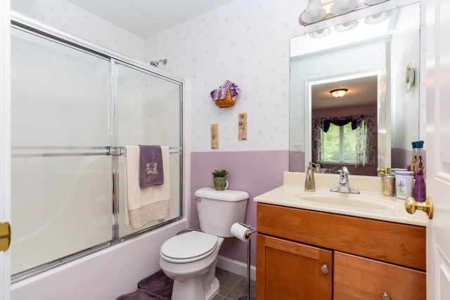 7009 Suncrest Dr, Saline, MI 48176 - bathroom with wallpapered walls, vanity, toilet, combined bath / shower with glass door, and tile patterned flooring