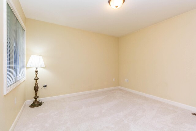7009 Suncrest Dr, Saline, MI 48176 - unfurnished room featuring light colored carpet and baseboards
