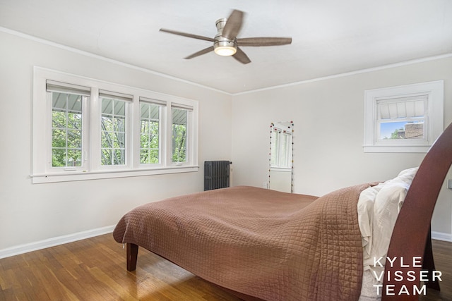 1058 Eastwood Ave SE, East Grand Rapids, MI 49506 - bedroom with wood finished floors, baseboards, crown molding, and a ceiling fan
