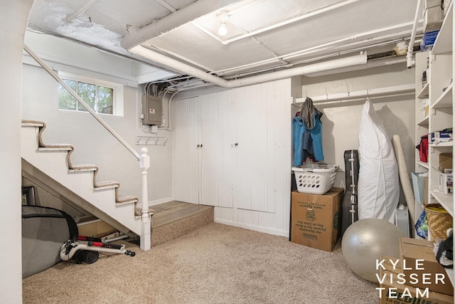 1058 Eastwood Ave SE, East Grand Rapids, MI 49506 - below grade area with carpet floors, electric panel, and stairway
