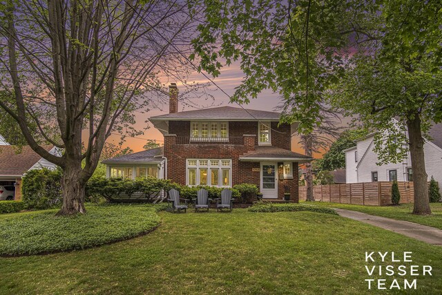 1058 Eastwood Ave SE, East Grand Rapids, MI 49506 - view of front of house featuring a chimney and brick siding