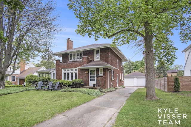 1058 Eastwood Ave SE, East Grand Rapids, MI 49506 - view of front of house with brick siding, an outdoor structure, a chimney, and a detached garage