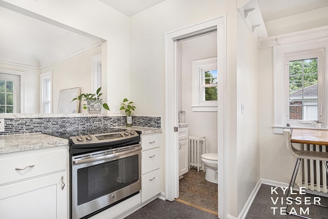 1058 Eastwood Ave SE, East Grand Rapids, MI 49506 - kitchen featuring electric range, radiator heating unit, and plenty of natural light