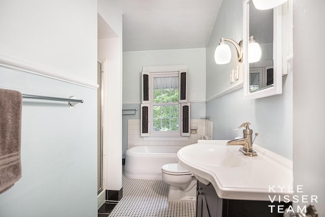 1058 Eastwood Ave SE, East Grand Rapids, MI 49506 - full bathroom with tile walls, a stall shower, a bathtub, vanity, and toilet