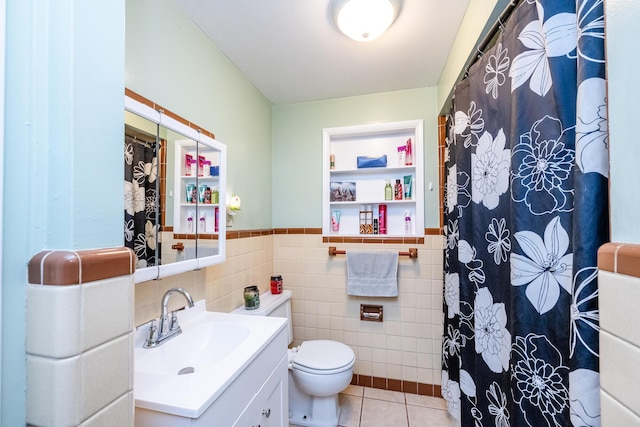 1402 Niles Buchanan Rd, Niles, MI 49120 - bathroom with tile walls, tile patterned flooring, toilet, vanity, and wainscoting