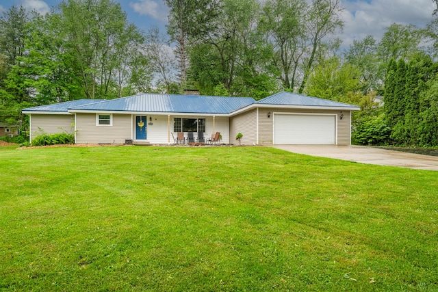 1402 Niles Buchanan Rd, Niles, MI 49120 - ranch-style home featuring an attached garage, driveway, a front lawn, a chimney, and metal roof