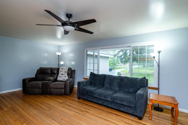 1402 Niles Buchanan Rd, Niles, MI 49120 - living room featuring baseboards, light wood finished floors, and ceiling fan