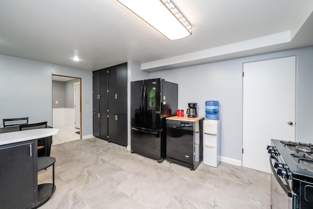 1402 Niles Buchanan Rd, Niles, MI 49120 - kitchen featuring black appliances, light marble finish flooring, dark cabinetry, and light countertops