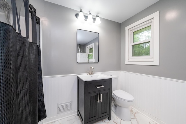 1402 Niles Buchanan Rd, Niles, MI 49120 - full bathroom featuring marble finish flooring, wainscoting, toilet, vanity, and curtained shower