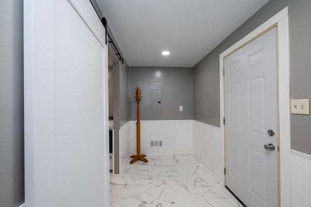 1402 Niles Buchanan Rd, Niles, MI 49120 - washroom with marble look tiles, a wainscoted wall, electric panel, a barn door, and recessed lighting