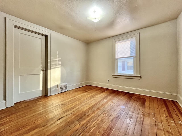 1837 Franklin St, Muskegon, MI 49441 - spare room featuring hardwood / wood-style flooring and baseboards