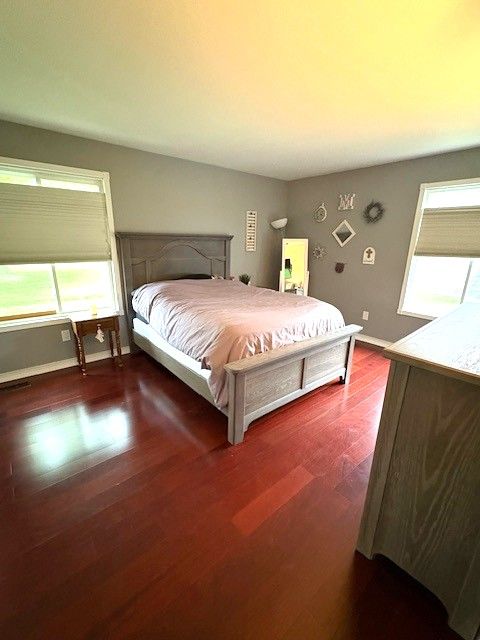 1376 Leisure Dr, Flint, MI 48507 - bedroom featuring wood finished floors and baseboards