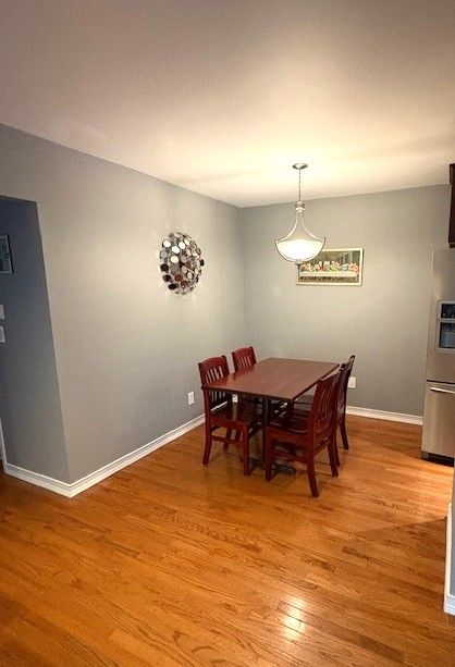 1376 Leisure Dr, Flint, MI 48507 - dining room with light wood-style floors and baseboards