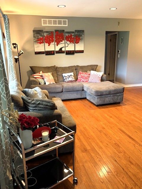 1376 Leisure Dr, Flint, MI 48507 - living area featuring wood finished floors, baseboards, and recessed lighting