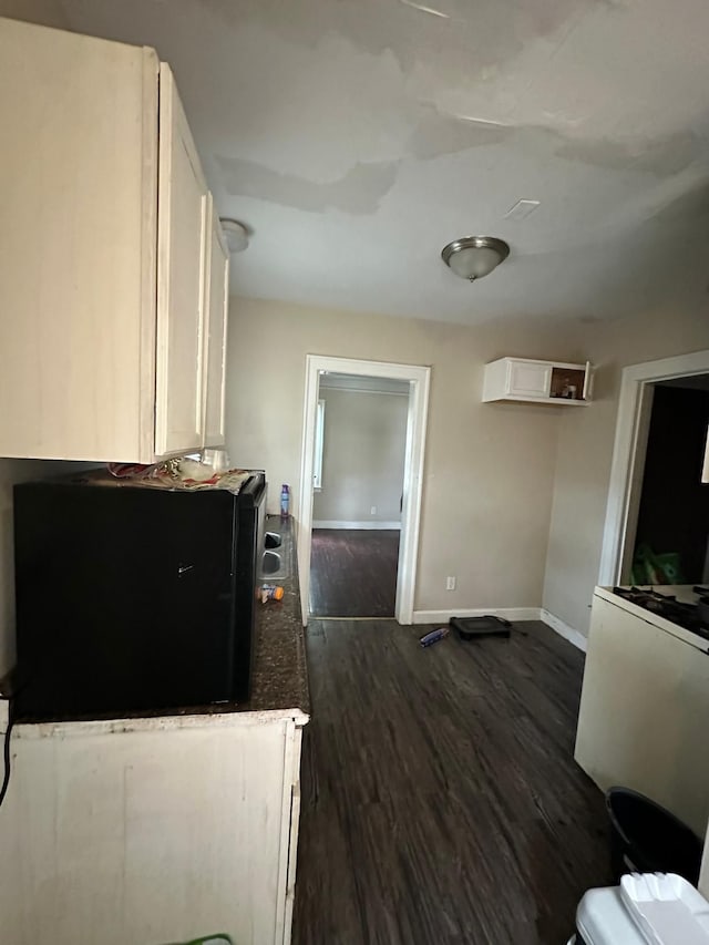 13639 Mecca St, Detroit, MI 48227 - kitchen with white cabinetry, baseboards, and dark wood finished floors