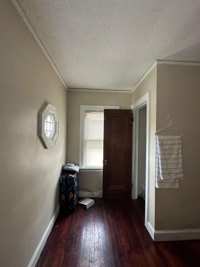 13639 Mecca St, Detroit, MI 48227 - spare room featuring hardwood / wood-style floors, a textured ceiling, ornamental molding, and baseboards