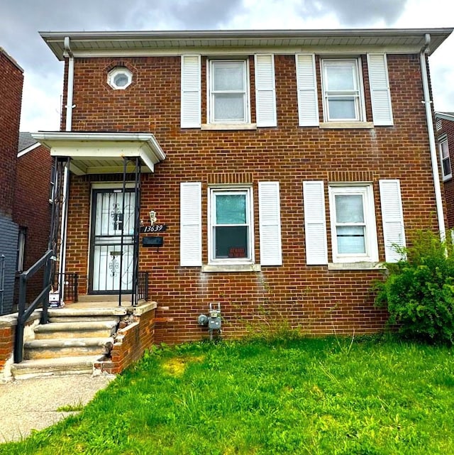 13639 Mecca St, Detroit, MI 48227 - view of front of house with brick siding and a front lawn