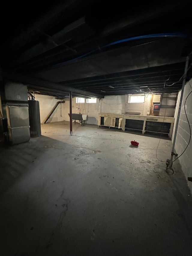 13639 Mecca St, Detroit, MI 48227 - basement with gas water heater, heating unit, and plenty of natural light