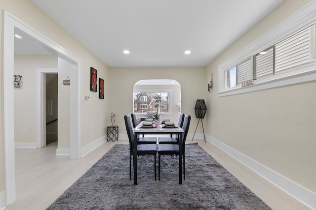 18929 Santa Rosa Dr, Detroit, MI 48221 - dining room with arched walkways, light wood finished floors, recessed lighting, and baseboards