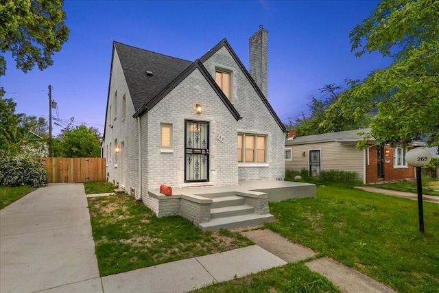 269 Newport St, Detroit, MI 48215 - view of front of property with a chimney, brick siding, and a shingled roof