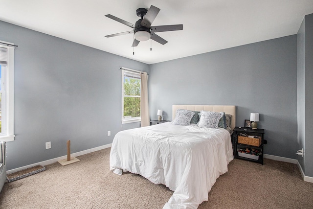 737 Bates St SE, Grand Rapids, MI 49503 - carpeted bedroom with baseboards and a ceiling fan