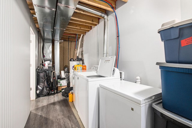 737 Bates St SE, Grand Rapids, MI 49503 - laundry room featuring water heater, washer and clothes dryer, and wood finished floors