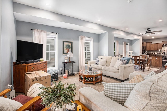 737 Bates St SE, Grand Rapids, MI 49503 - living room with a ceiling fan, recessed lighting, light colored carpet, and baseboards