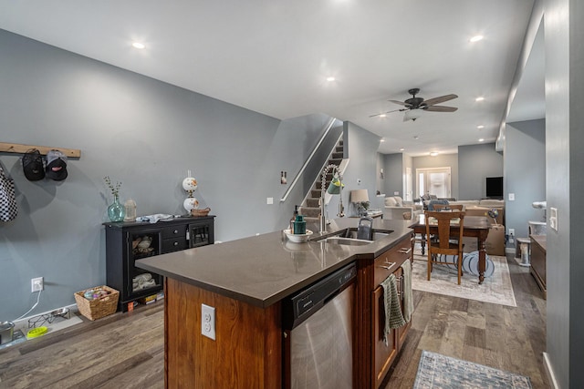 737 Bates St SE, Grand Rapids, MI 49503 - kitchen with stainless steel dishwasher, dark wood-type flooring, a ceiling fan, a sink, and recessed lighting