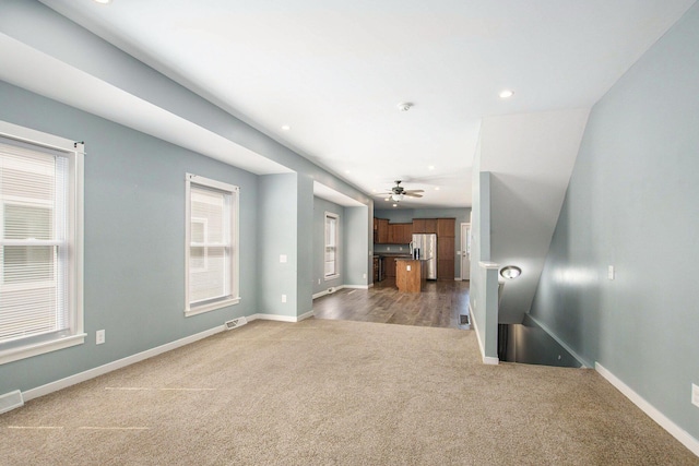 737 Bates St SE, Grand Rapids, MI 49503 - unfurnished living room with carpet flooring, a ceiling fan, and recessed lighting
