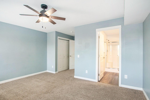 737 Bates St SE, Grand Rapids, MI 49503 - unfurnished bedroom featuring carpet, a closet, ensuite bath, and a ceiling fan