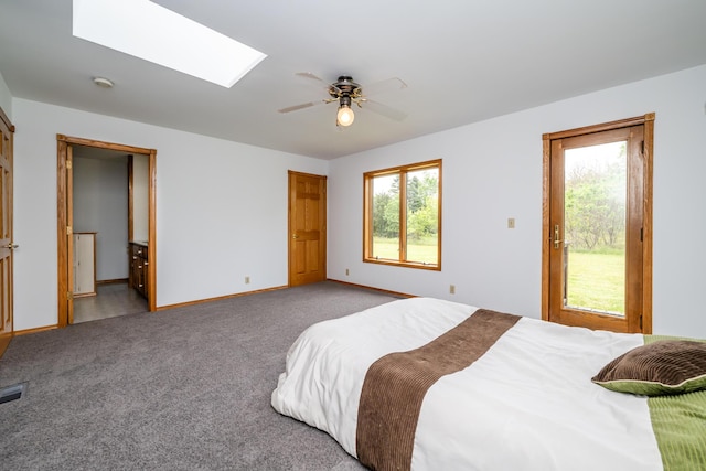 5142 Becht Rd, Coloma, MI 49038 - carpeted bedroom featuring multiple windows, a skylight, baseboards, and access to exterior