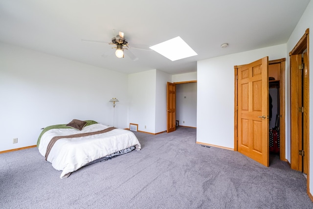 5142 Becht Rd, Coloma, MI 49038 - bedroom featuring a skylight, carpet flooring, baseboards, and a ceiling fan