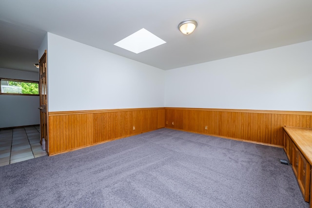 5142 Becht Rd, Coloma, MI 49038 - carpeted spare room with a skylight, a wainscoted wall, and wood walls