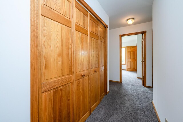 5142 Becht Rd, Coloma, MI 49038 - corridor featuring dark carpet and baseboards
