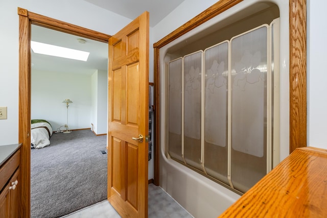 5142 Becht Rd, Coloma, MI 49038 - bathroom with a skylight and shower / bath combination with glass door