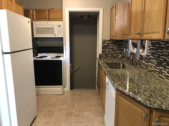 19381 Kenosha St, Harper Woods, MI 48225 - kitchen with white appliances, a sink, tasteful backsplash, and dark stone countertops