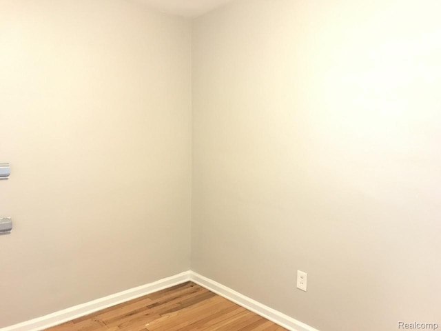 19381 Kenosha St, Harper Woods, MI 48225 - spare room featuring baseboards and light wood-style floors