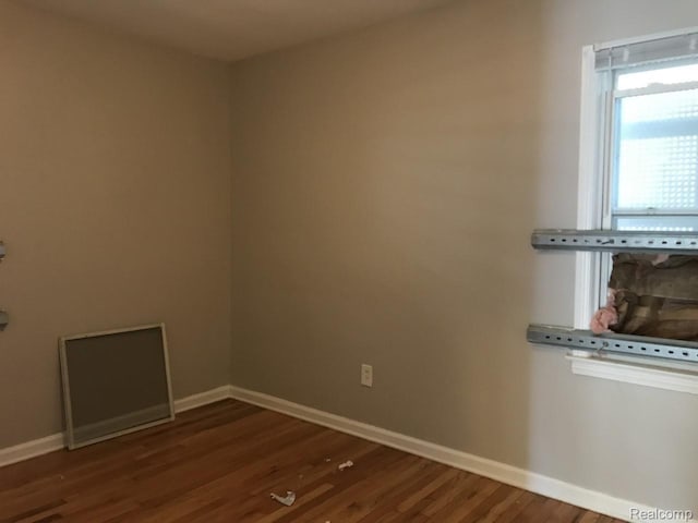 19381 Kenosha St, Harper Woods, MI 48225 - unfurnished room with wood finished floors and baseboards