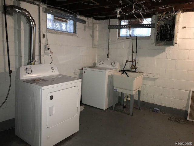 19381 Kenosha St, Harper Woods, MI 48225 - laundry room with washer and clothes dryer, electric panel, and plenty of natural light