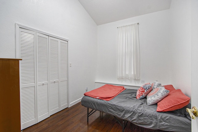 1912 E Centre Ave, Portage, MI 49002 - bedroom featuring lofted ceiling, wood finished floors, a closet, and baseboards